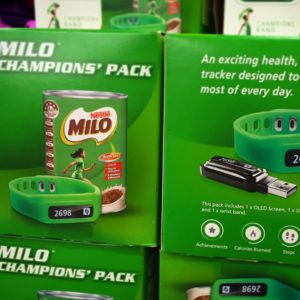 Example of diet culture for kids: a stack of boxes containing Nestle Milo branded activity trackers for children