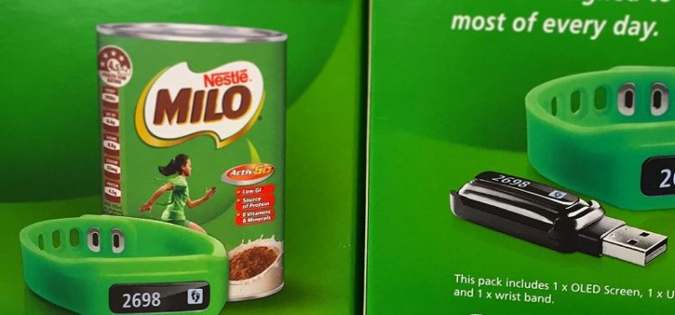 Example of diet culture for kids: a stack of boxes containing Nestle Milo branded activity trackers for children